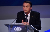 Brazilian presidential candidate Jair Bolsonaro (PSL), speaks during the first presidential debate ahead of the October 7 general election, at Bandeirantes television network in Sao Paulo, Brazil, on August 9, 2018. (Photo by Nelson ALMEIDA / AFP)