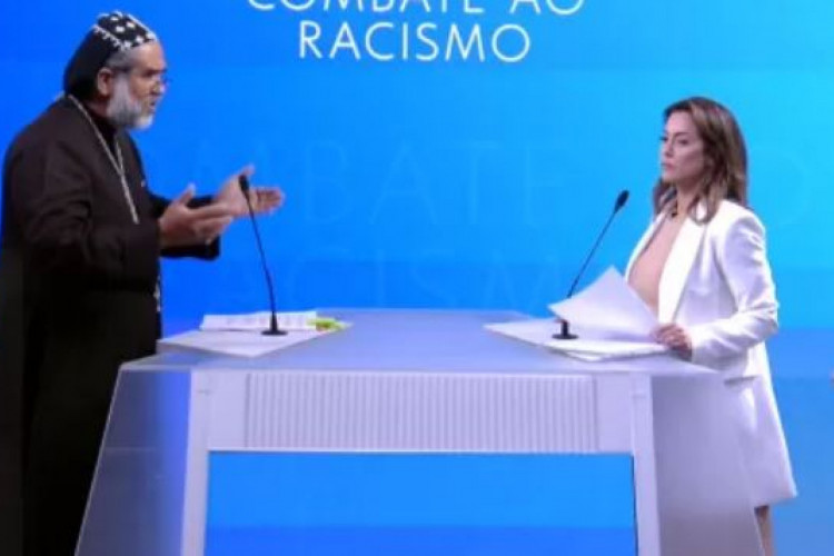 Soraya Thronicke e Padre Kelmon durante debate da Globo