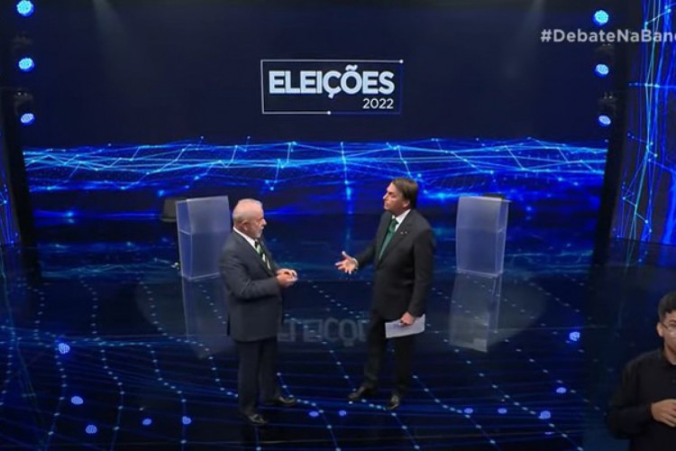 Lula e Jair Bolsonaro durante debate na Band 