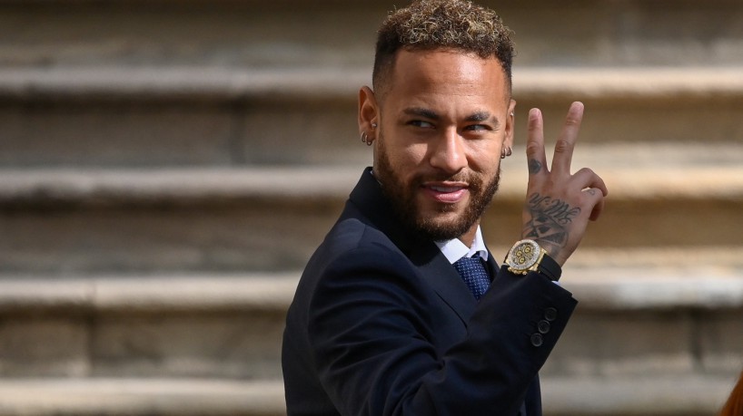 (FILES) In this file photo taken on October 18, 2022, Paris Saint-Germain's Brazilian forward Neymar gestures as he leaves after attending a hearing at the courthouse in Barcelona, on the second day of his trial. - A Barcelona court on December 13, 2022, acquitted Brazilian football star Neymar and all of his co-defendants in the trial over alleged irregularities during his transfer to FC Barcelona in 2013. The judges decided to 