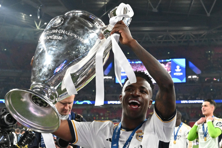 Real Madrid's players lift the trophy to celebrate their victory at the end of the UEFA Champions League final football match between Borussia Dortmund and Real Madrid, at Wembley stadium, in London, on June 1, 2024. (Photo by INA FASSBENDER / AFP)