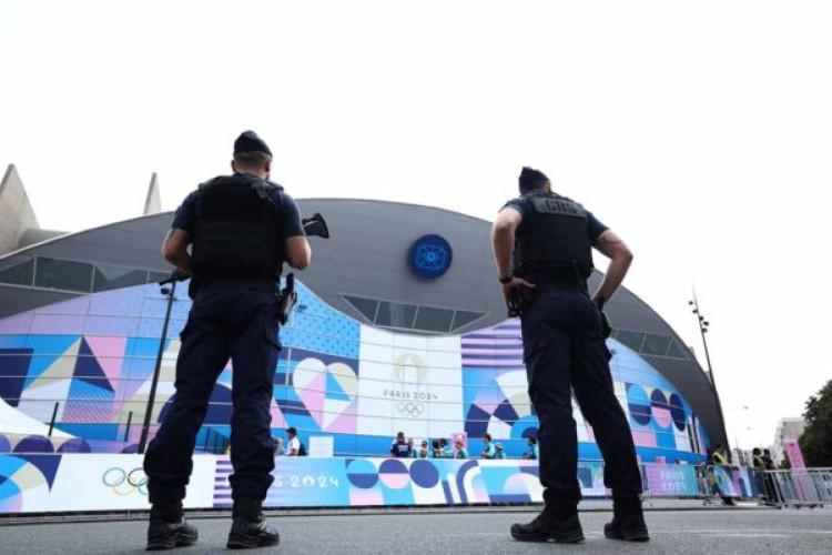 French CRS riot police stand guard near the Parc des Princes ahead of the men's group C football match between Uzbekistan and Spain, during the Paris 2024 Olympic Games in Paris on July 24, 2024. (Photo by FRANCK FIFE / AFP) (Photo by FRANCK FIFE/AFP via Getty Images)