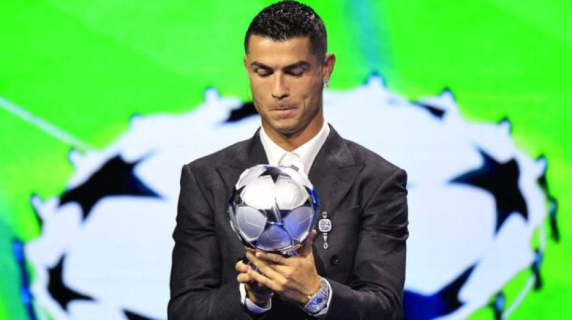 Portugal's national team player and Saudi Al-Nassr's forward Cristiano Ronaldo receives the All-Time Goalscorer Award in the UEFA Champions League during the ceremony of the draw for the group stage of the 2024-2025 UEFA Champions League football tournament, at the Grimaldi Forum in Monaco on August 29, 2024. (Photo by Valery HACHE / AFP) (Photo by VALERY HACHE/AFP via Getty Images)