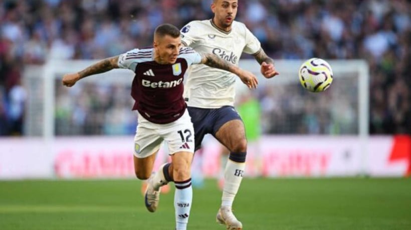 BIRMINGHAM, ENGLAND - SEPTEMBER 14: Lucas Digne of Aston Villa is challenged by Dwight McNeil of Everton during the Premier League match between Aston Villa FC and Everton FC at Villa Park on September 14, 2024 in Birmingham, England. (Photo by Shaun Botterill/Getty Images)