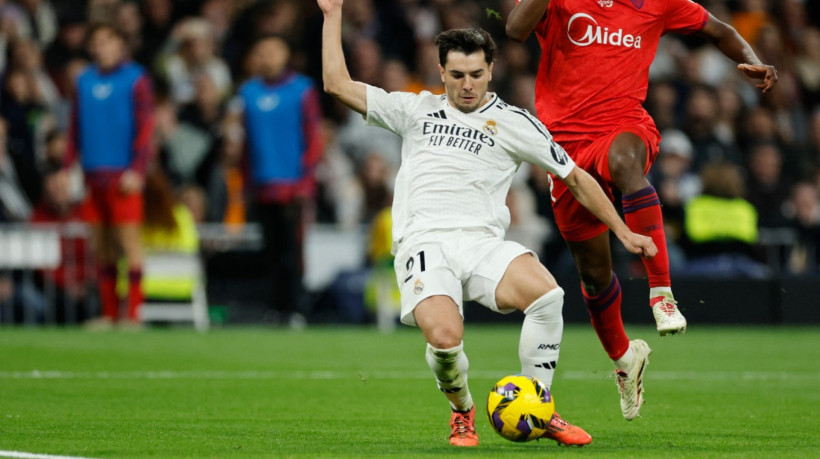 Real Madrid's Moroccan forward #21 Brahim Diaz scores his team's fourth goal during the Spanish league football match between Real Madrid CF and Sevilla FC at the Santiago Bernabeu stadium in Madrid on December 22, 2024.