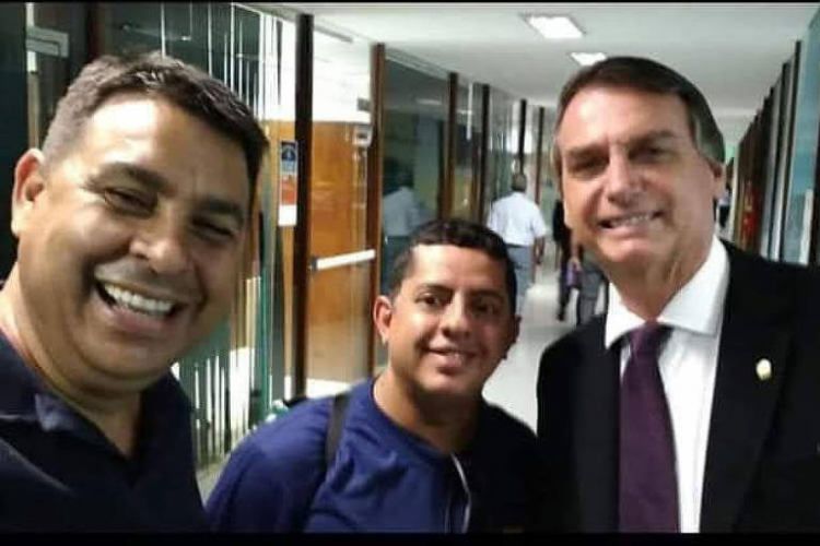 O guarda municipal e militante do PT, Marcelo Arruda, em 2017, durante  encontro com o então deputado federal Jair Bolsonaro, para tratar de questões sindicais